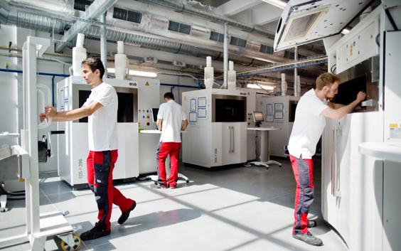 Materialise employees working in a laser sintering production area