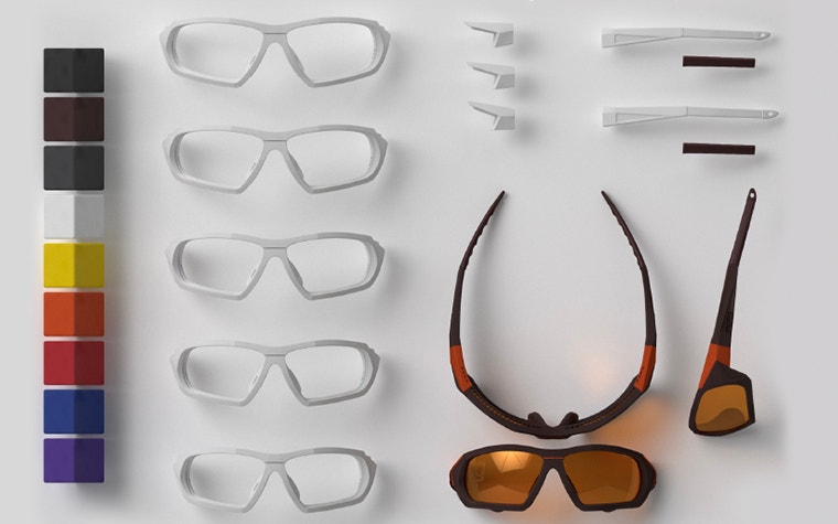 Overview photo showing the 9 color options, plus white samples of the different 3D-printed frame sizes, inclination angles and temple sizes