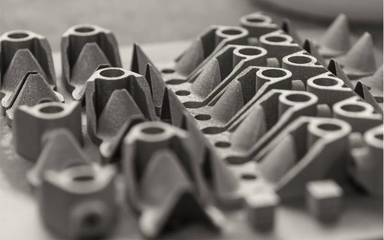 Rows of 3D-printed parts in metal