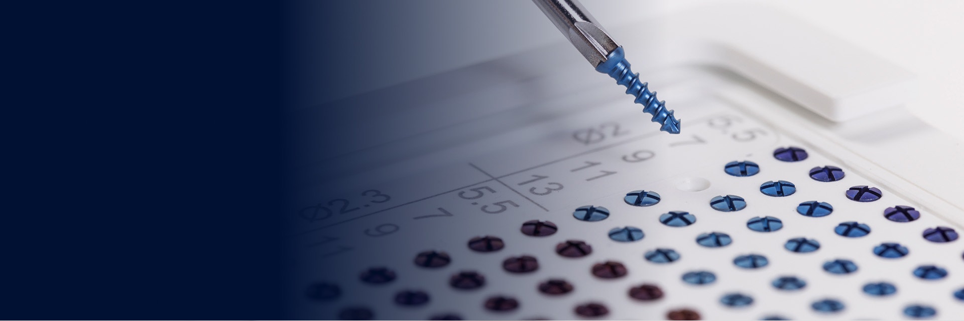 A screwdriver picking up a screw from a Materialise Standard+ Solutions module