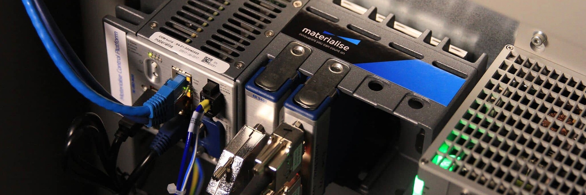 View of the Materialise Control Platform hardware plugged into a 3D printer