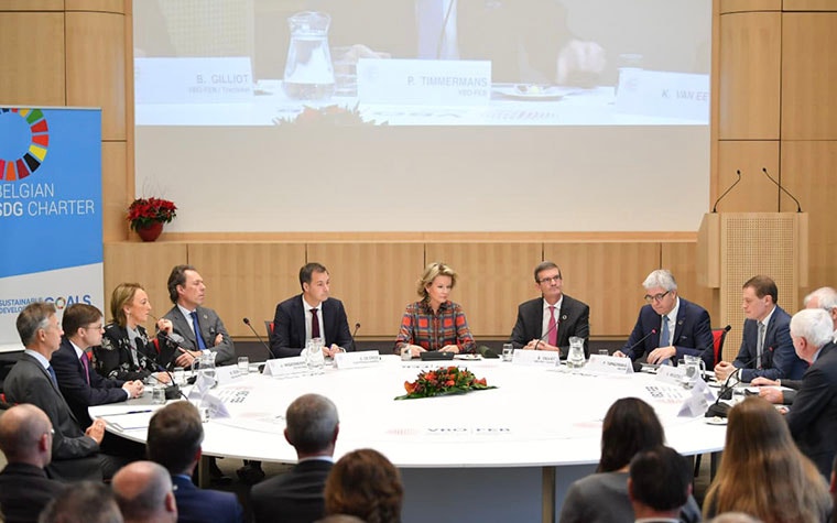 Her Majesty Queen Mathilde, the Queen of Belgium, leading a round-table discussion at an event