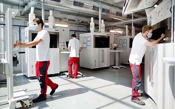 EOS 3D printing systems in operation at a Materialise Manufacturing facility.