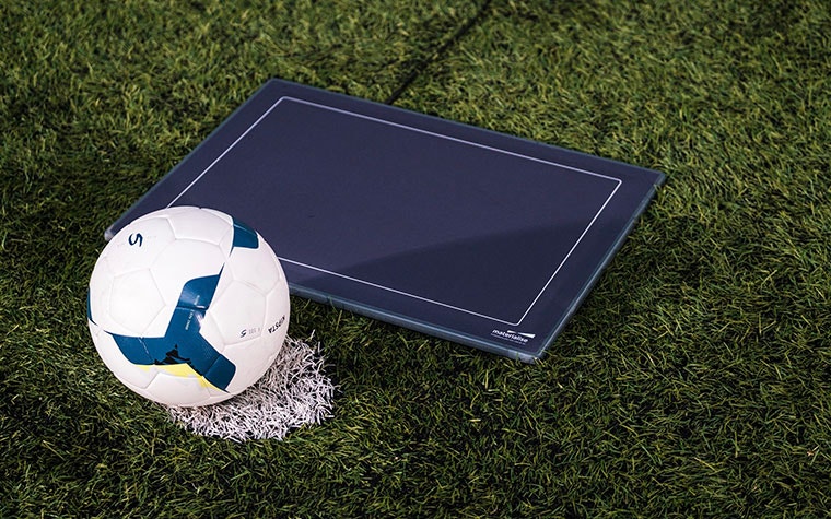 A pressure plate and soccer ball