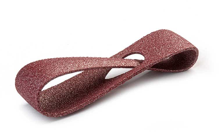 A glittering, deep Bordeaux red 3D-printed loop made from PA-AF (aluminum filled) using laser sintering, with a color-dyed finish.