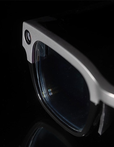 A close up shot of the left-hand lens of the Vuzix Shield smart glasses.