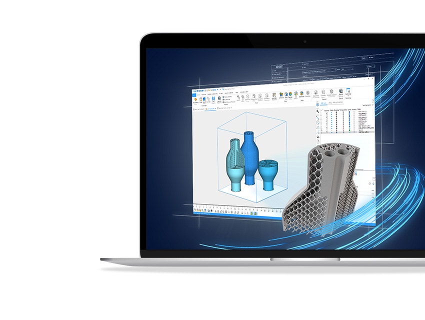 A laptop showing three, 3D models being designed in Magics and a larger, lattice-inspired 3D model.