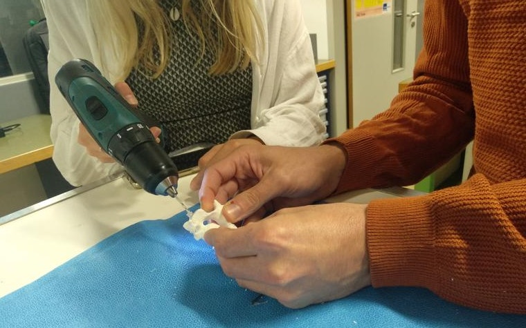 A student drills into a personalized medical implant.