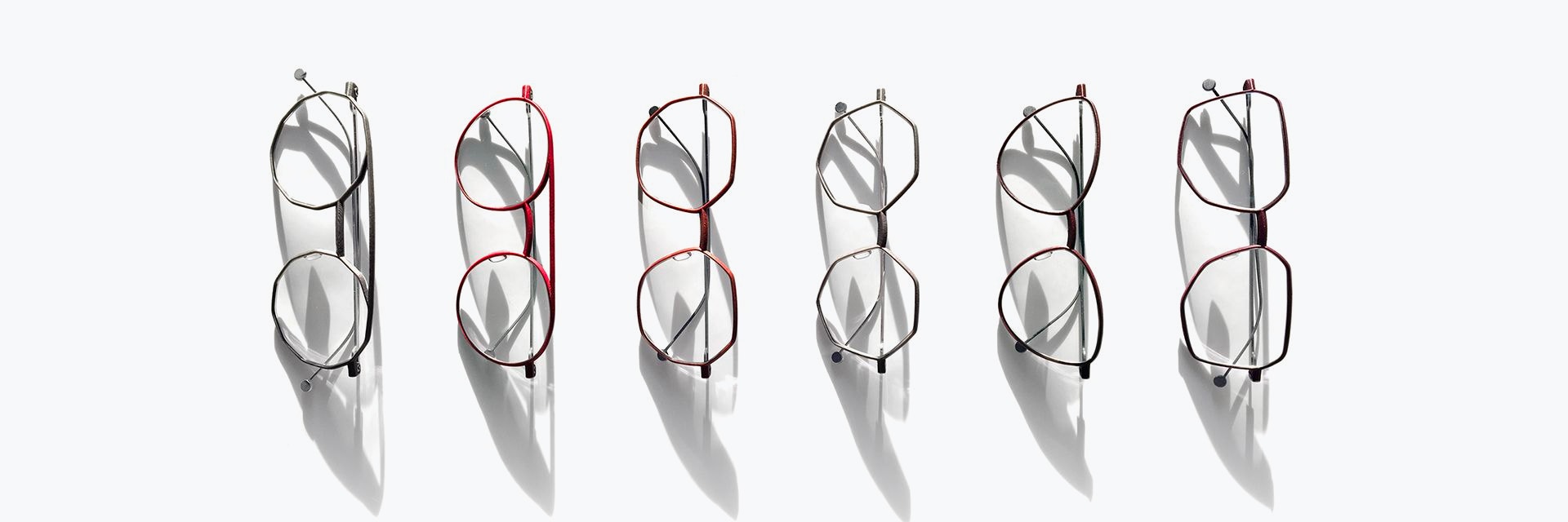 Row of eyeglasses from NEON Berling in different shapes and colors