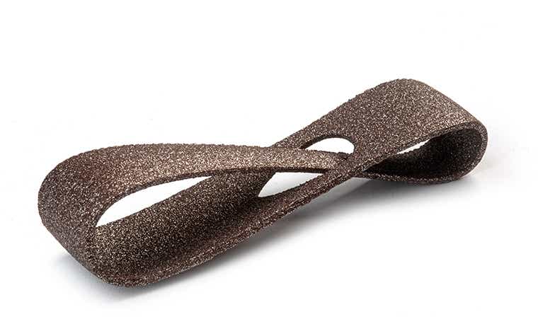 A glittering brown 3D-printed loop made from PA-AF (aluminum filled) using laser sintering, with a color-dyed finish.