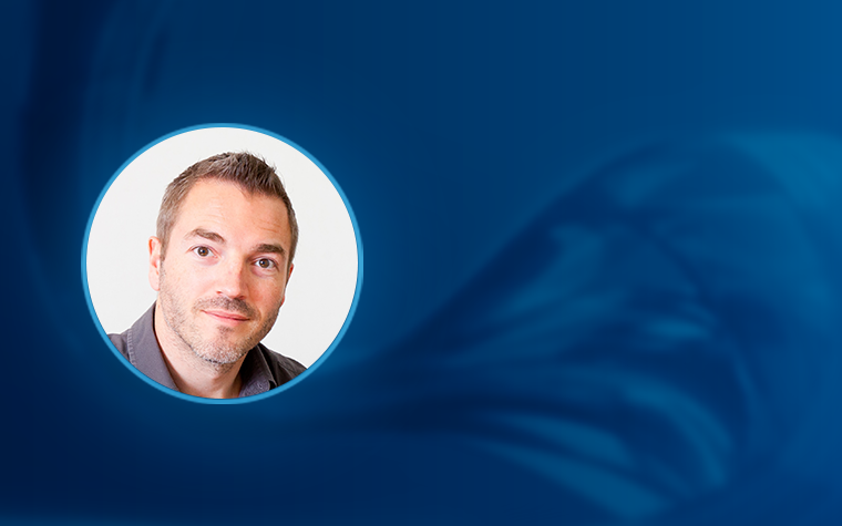 A headshot of Tim Van Cleynenbreugel inside a white circle, set against a blue background with a silk-like wave running across it.