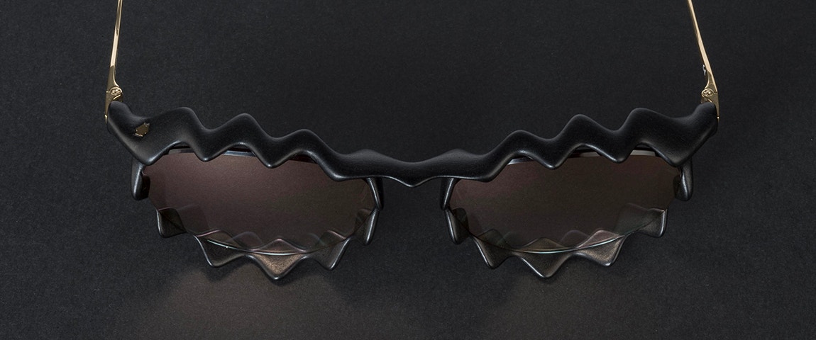 Top view of Impressio 609 Vortex sunglasses on a black background