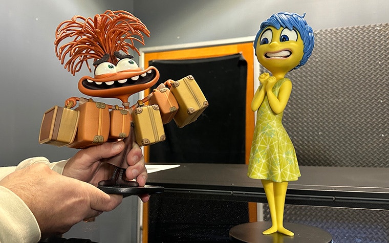 3D-printed, colorful models of Joy and Anxiety from Pixar's Inside Out 2, created by Gentle Giant Studio