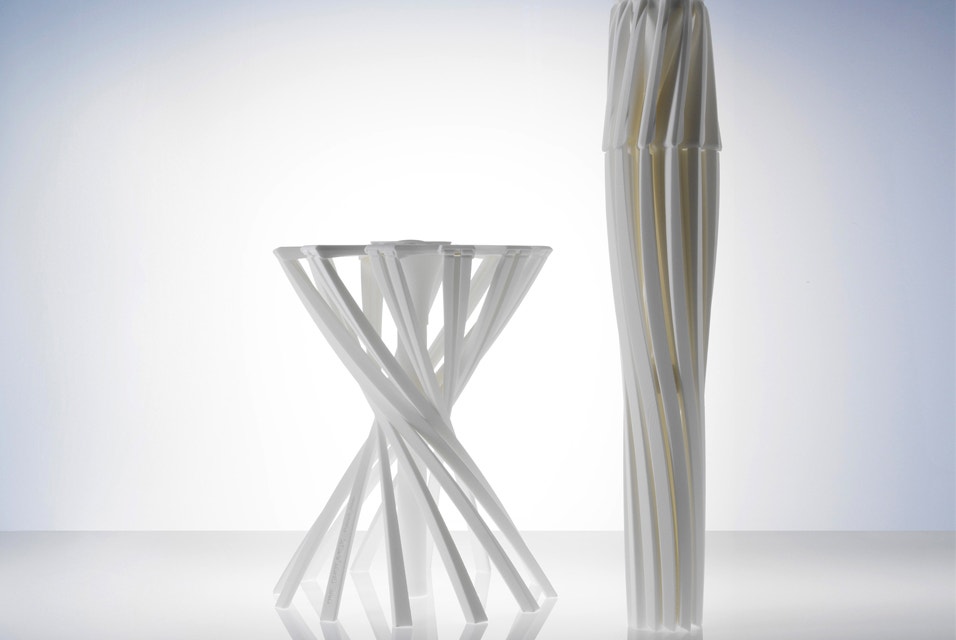 Two 3D-printed foldable stools, the One_Shot.MGX by Patrick Jouin, one shown opened as stool, the other folded  