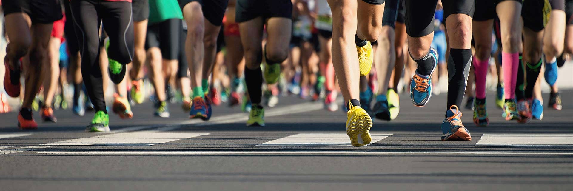 View of runners' legs running as they begin a race