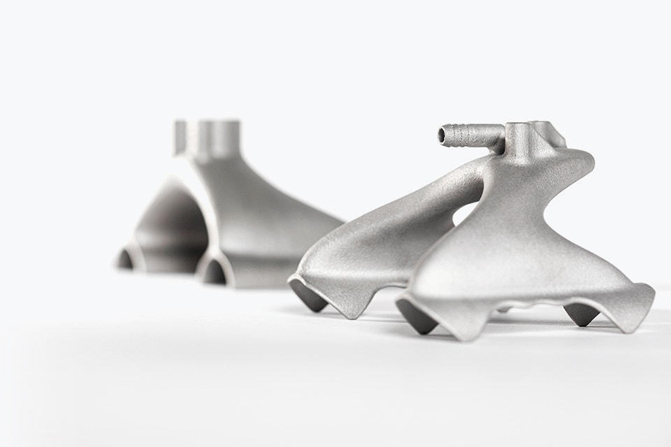 Two 3D-printed metal grippers with a design optimized for 3D printing