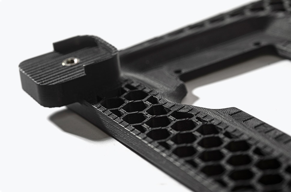 3D-printed black parts printed in ABS-ESD7 and connected by a screw