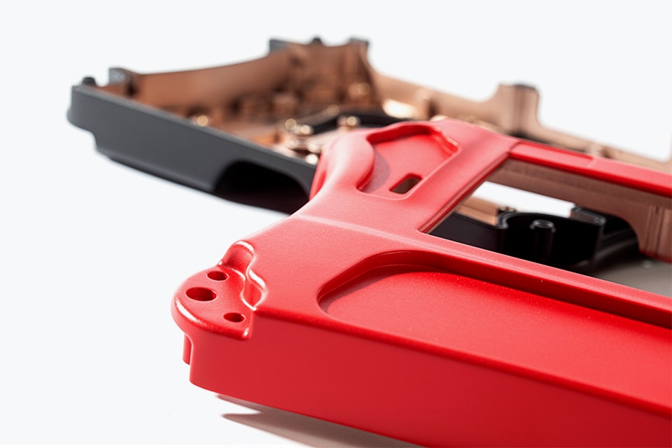 Close-up view of a red and black part of a portable crack detector, vacuum casted using the ABS-like polyurethane material