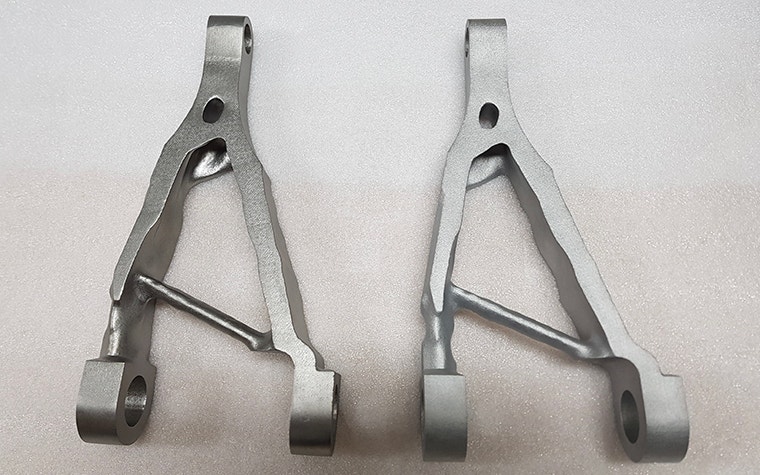 Triangular metal aerospace part. 