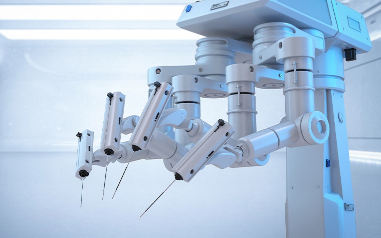 A surgical robot with four needles in a white, well-lit room.