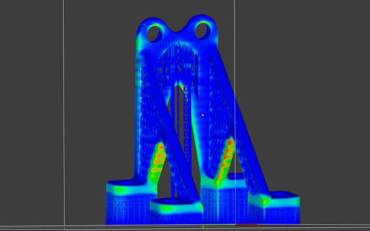 The heat signature of a 3D model being analyzed in the Ansys Simulation module. The legs/beams are red while the rest of the model is blue.