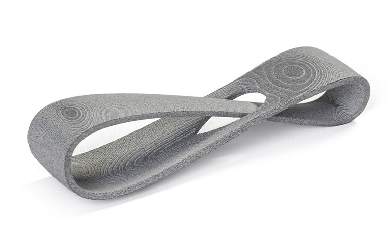 A gray 3D-printed loop made in PA 12S using Multi Jet Fusion with a normal finish.