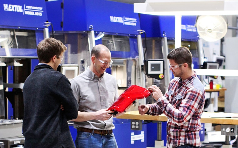 Extol workers on the production floor