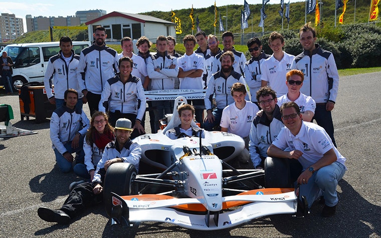The InMotion IM/e electric racecar team with the racecar