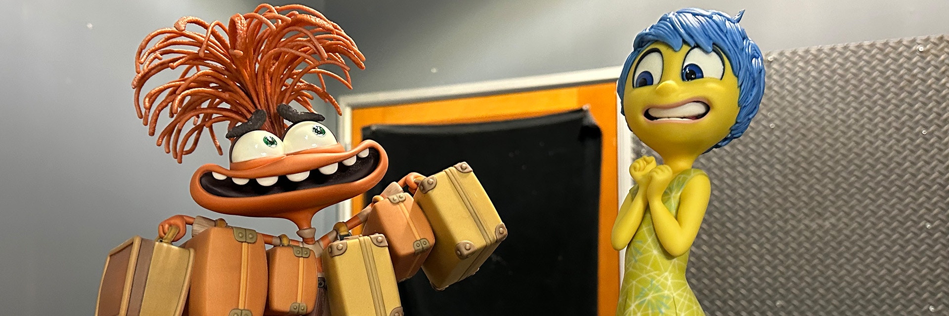 3D-printed, colorful models of Joy and Anxiety from Pixar's Inside Out 2, created by Gentle Giant Studio