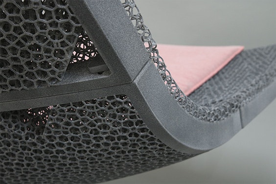 A close-up of a chair with a 3D-printed lattice design