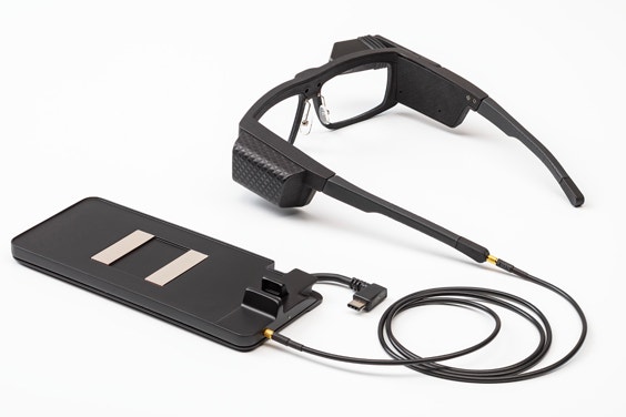 Iristick industrial smart glasses connected to a cabled docking station 