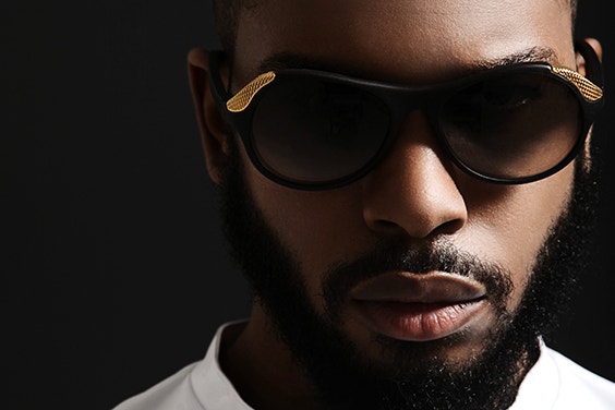 Close-up of a Black male model wearing sunglasses from the Hoet Cabrio collection