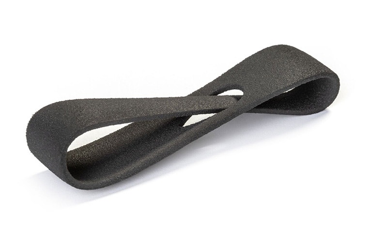 A dark gray 3D-printed loop made from Ultrasint TPU 90A-01 using Multi Jet Fusion, with a normal finish.