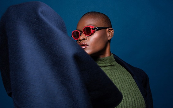 Model wearing red 3D-printed JF Rey frames