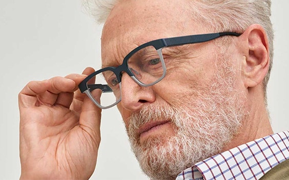 Older man wearing 3D-printed autofocal eyewear from Morrow