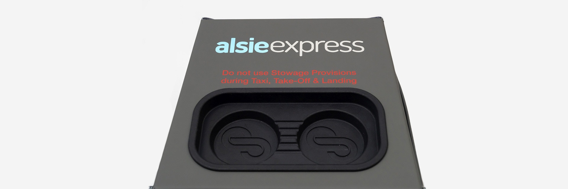 Stirling Dynamic's cube-like seat blocker, featuring handcrafted grey/green leather and a black 3D-printed insert in the top side for smartphones and other devices.