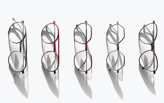 Row of eyeglasses from NEON Berlin in different shapes and colors