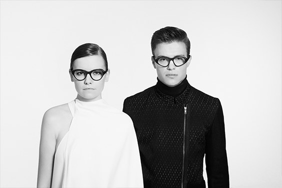 Male and female models in gray-scale wearing Hoet Cabrio eyewear