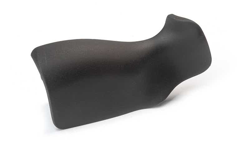 A matte black handle made with ABS-like Polyurethanes using vacuum casting, with a smooth finish.