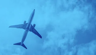 an airplane soars through the clouds. It is glorious.