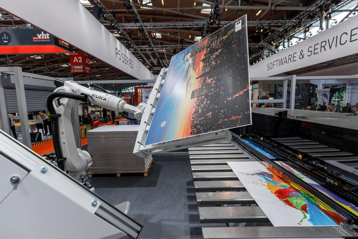 Robotic arm holding a large-format print