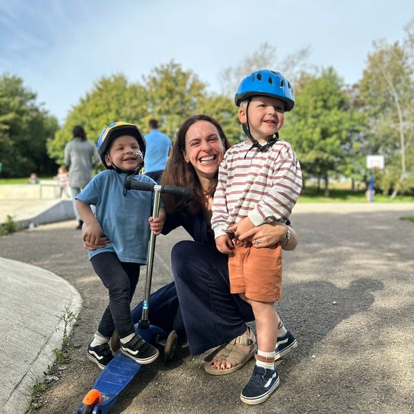 Jo Hughes with her sons smiling at the park Jo Hughes with her sons smiling at the park