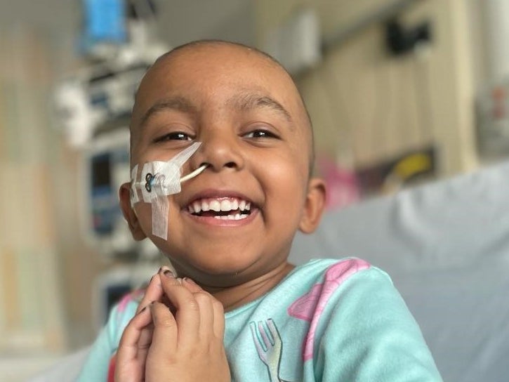 Image of Esha smiling at camera Image of Esha smiling at camera