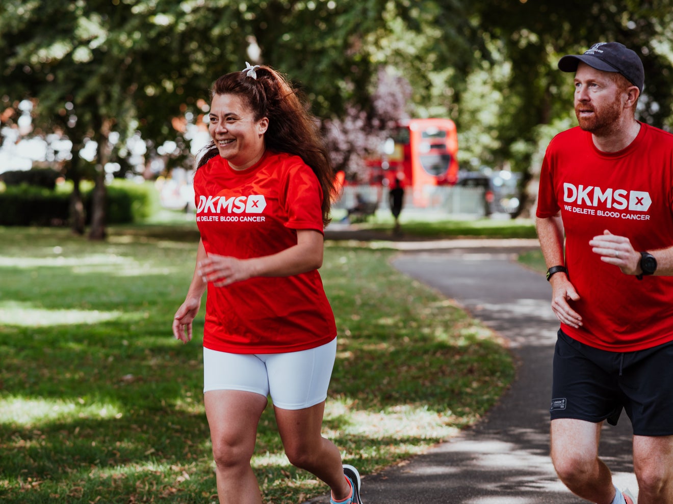 Image of two people running in DKMS t-shirts