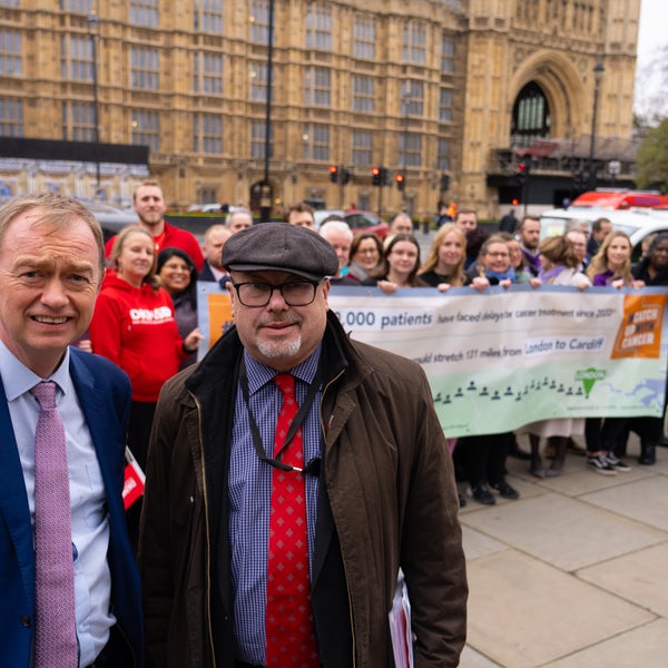 Two officials smiling at the camera at the catch up to cancer event Two officials smiling at the camera at the catch up to cancer event