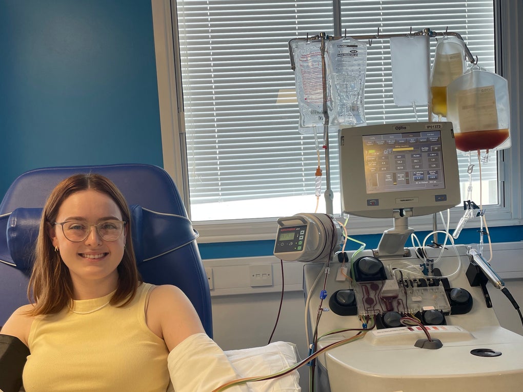 Lady on a hospital bed holding a bag of stem cells Lady on a hospital bed holding a bag of stem cells