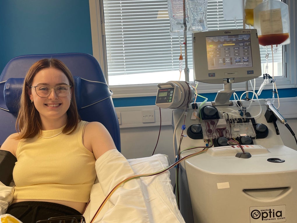 Lady on a hospital bed holding a bag of stem cells Lady on a hospital bed holding a bag of stem cells