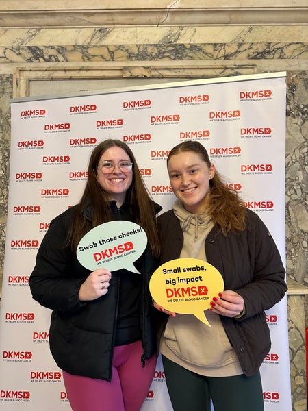 Two females smiling at a DKMS event