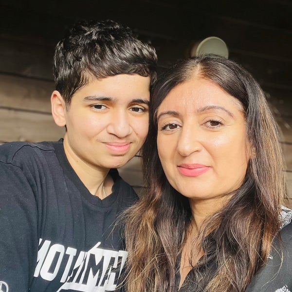 A selfie with a woman and her son smiling A selfie with a woman and her son smiling