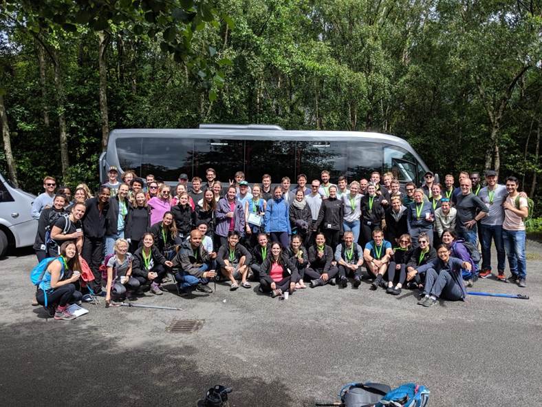 Go Cardless employees undertook the Three Peaks challenge to raise money for DKMS - Image shows a group of people from Go Cardless gathered in front of a coach